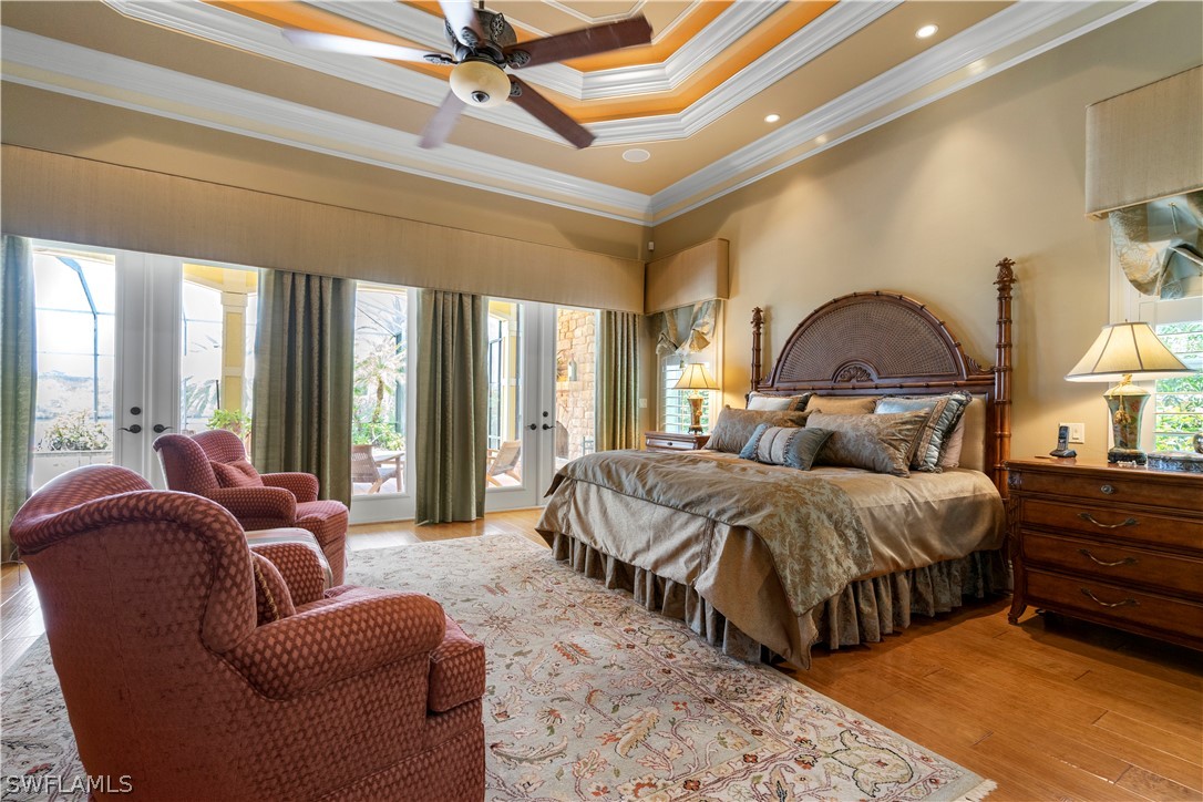 1980 Fort Denaud Road Fort Denaud, FL 33935 - Photo 20 of 35 a spacious bedroom with a bed a couch and large windows