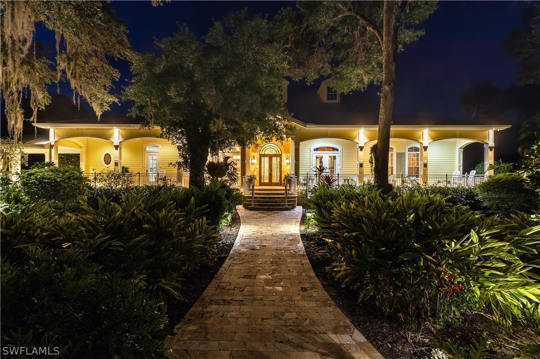 1980 Fort Denaud Road Fort Denaud, FL 33935 - Photo 3 of 35 a front view of a house with a yard