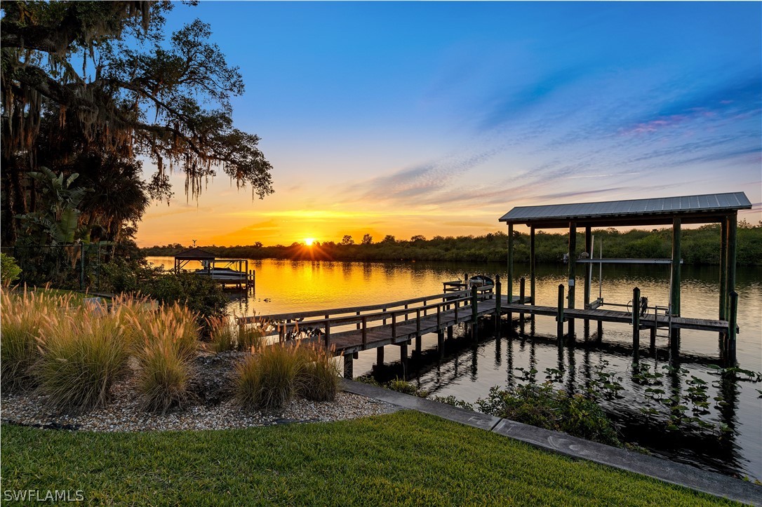 1980 Fort Denaud Road Fort Denaud, FL 33935 - Photo 31 of 35 a view of a lake with a garden