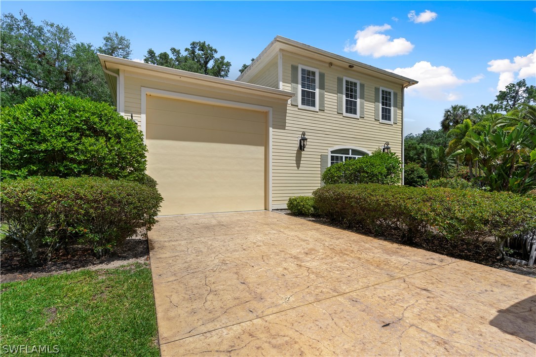 1980 Fort Denaud Road Fort Denaud, FL 33935 - Photo 34 of 35 a front view of a house with a yard