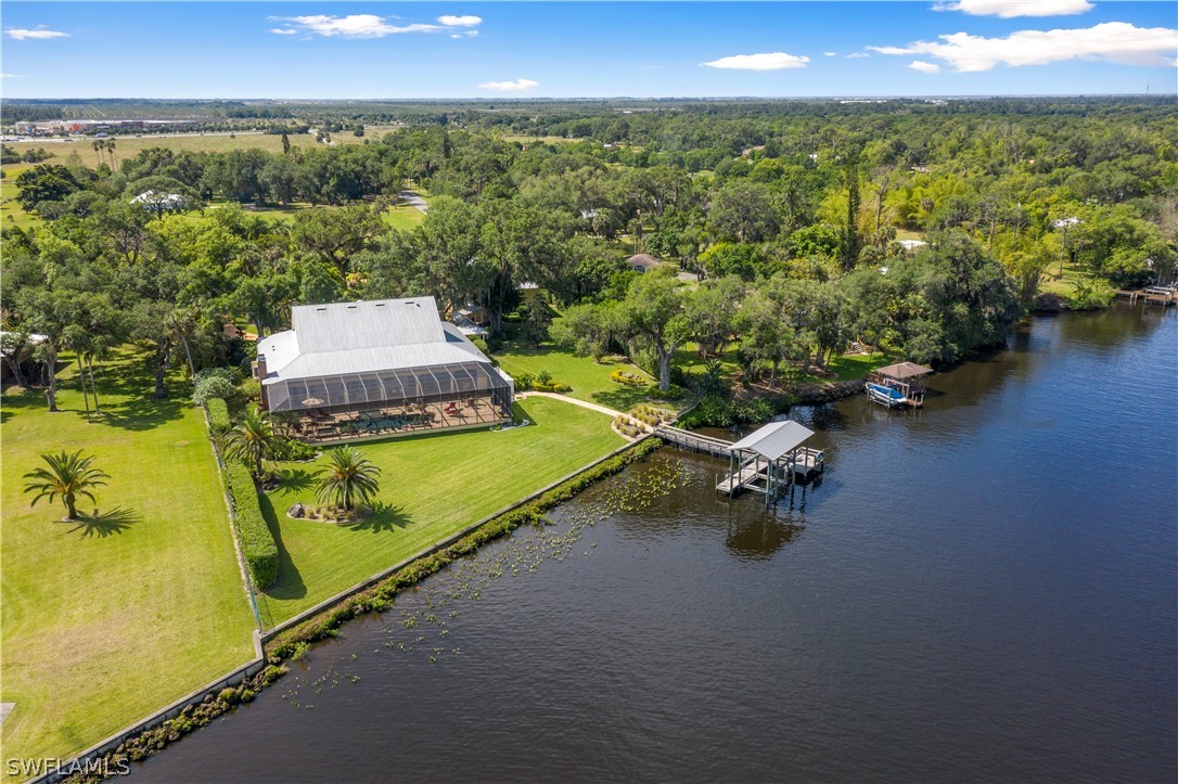 1980 Fort Denaud Road Fort Denaud, FL 33935 - Photo 35 of 35 a view of a swimming pool with an outdoor seating and yard