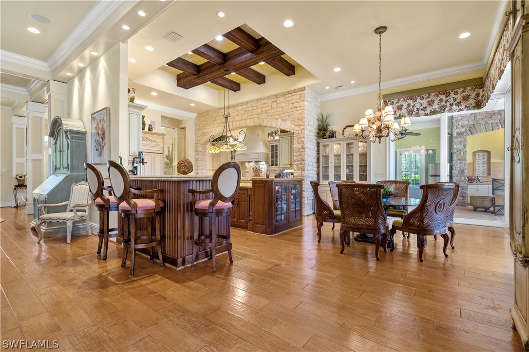 1980 Fort Denaud Road Fort Denaud, FL 33935 - Photo 9 of 35 a view of a dining area with furniture and chandelier