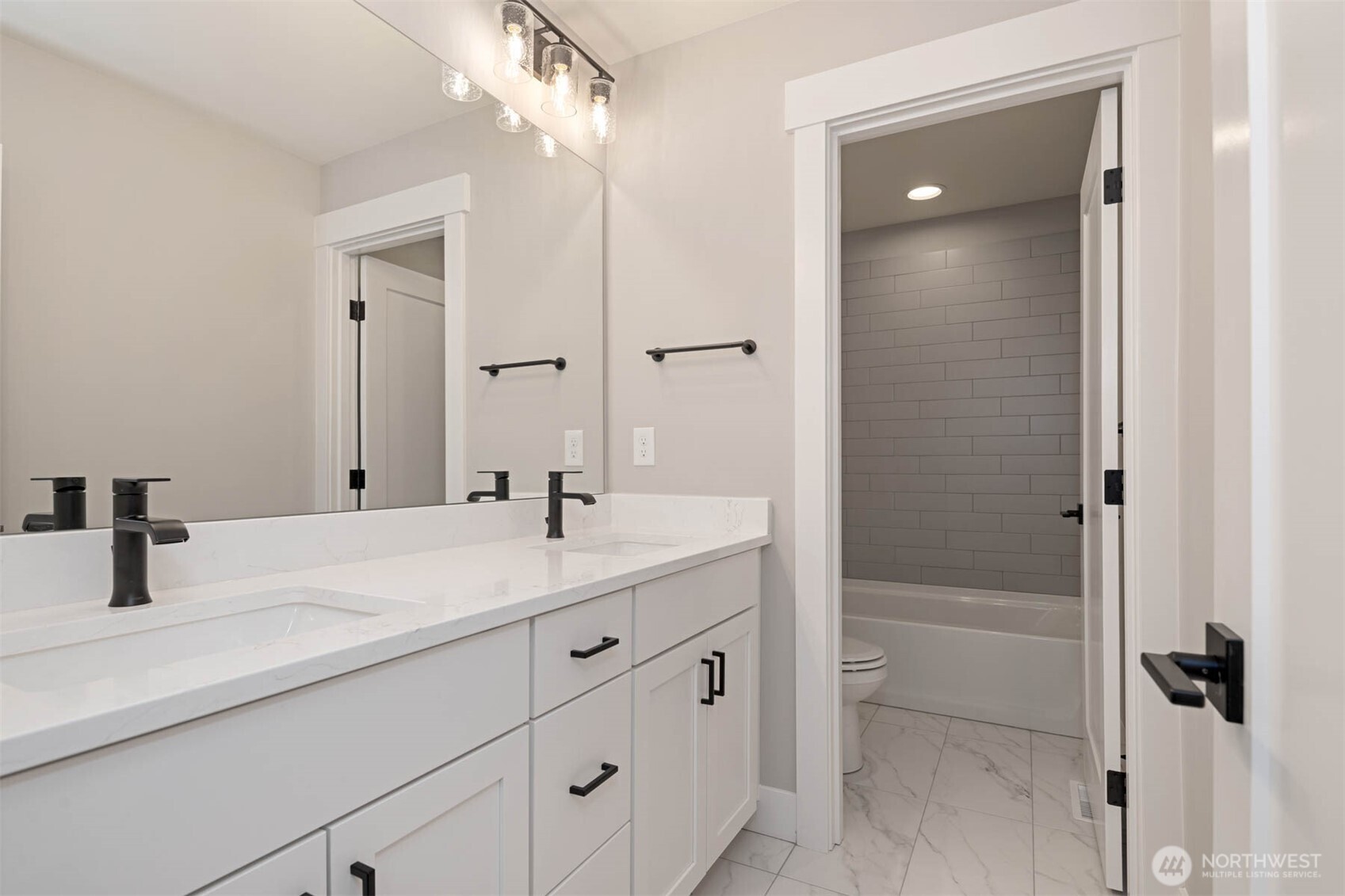 13030 75th Place South Seattle, WA 98178 - Photo 16 of 27 a bathroom with a tub sink and mirror