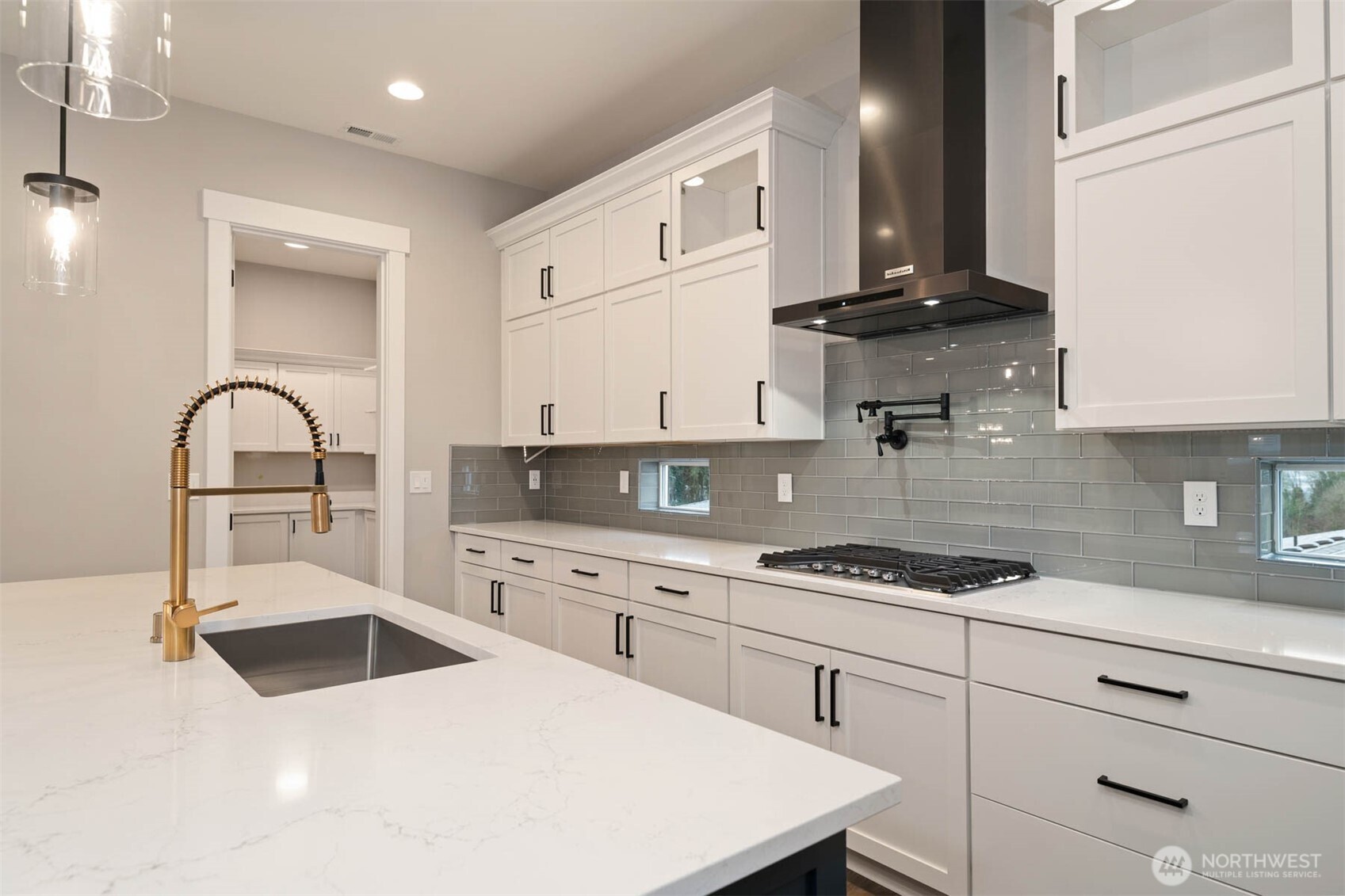 13030 75th Place South Seattle, WA 98178 - Photo 2 of 27 a kitchen with stainless steel appliances a sink a stove and cabinets