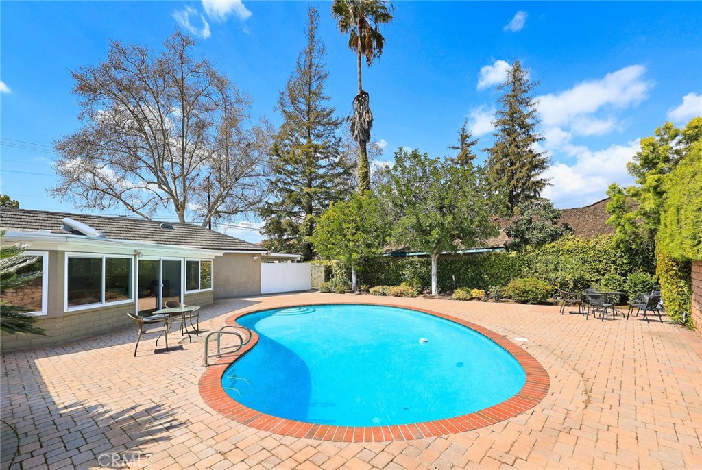 385 Walnut Avenue Arcadia, CA 91007 - Photo 5 of 7 a view of a swimming pool with an outdoor space and seating area