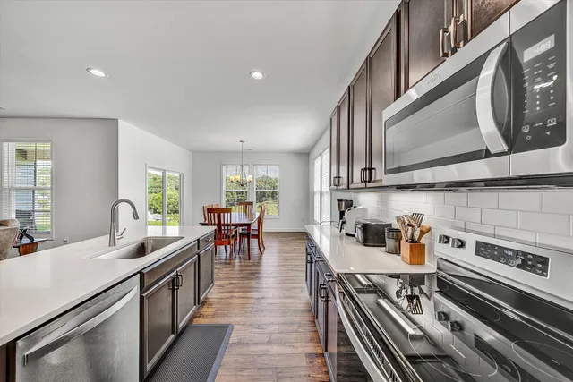 a view of a dining room with furniture window and outside view