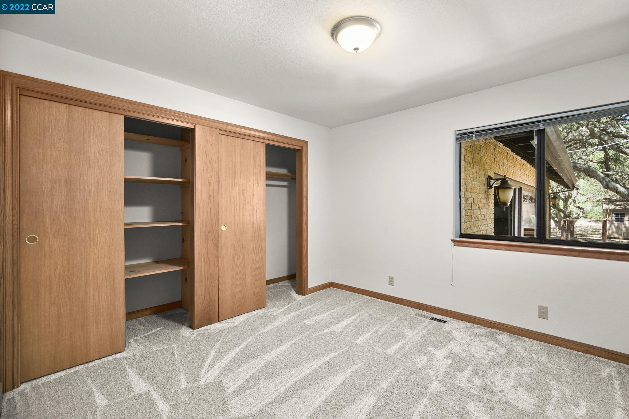 5433 Alhambra Valley Road Martinez, CA 94553 - Photo 28 of 59 a view of an empty room with a window