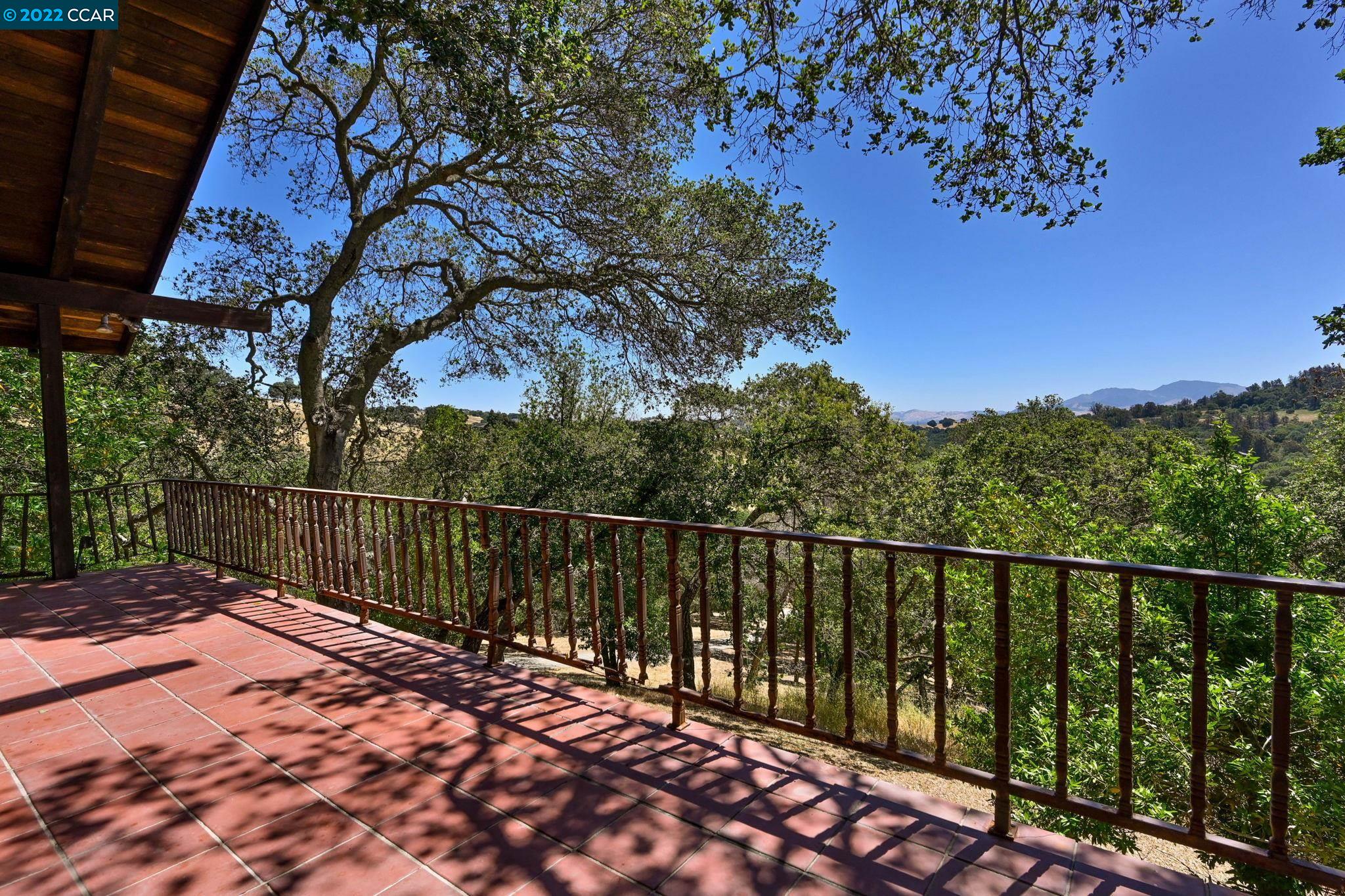 5433 Alhambra Valley Road Martinez, CA 94553 - Photo 34 of 59 a balcony with trees in front of it