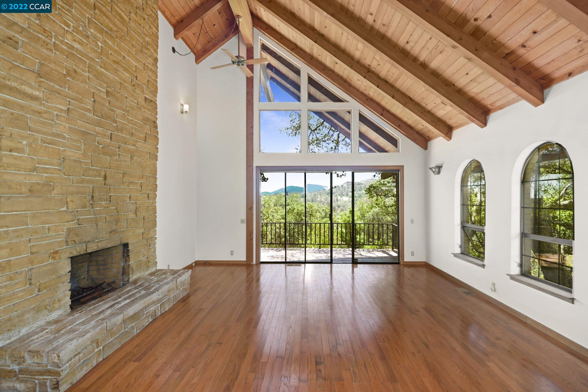 5433 Alhambra Valley Road Martinez, CA 94553 - Photo 4 of 59 wooden floor fireplace and windows in an empty room
