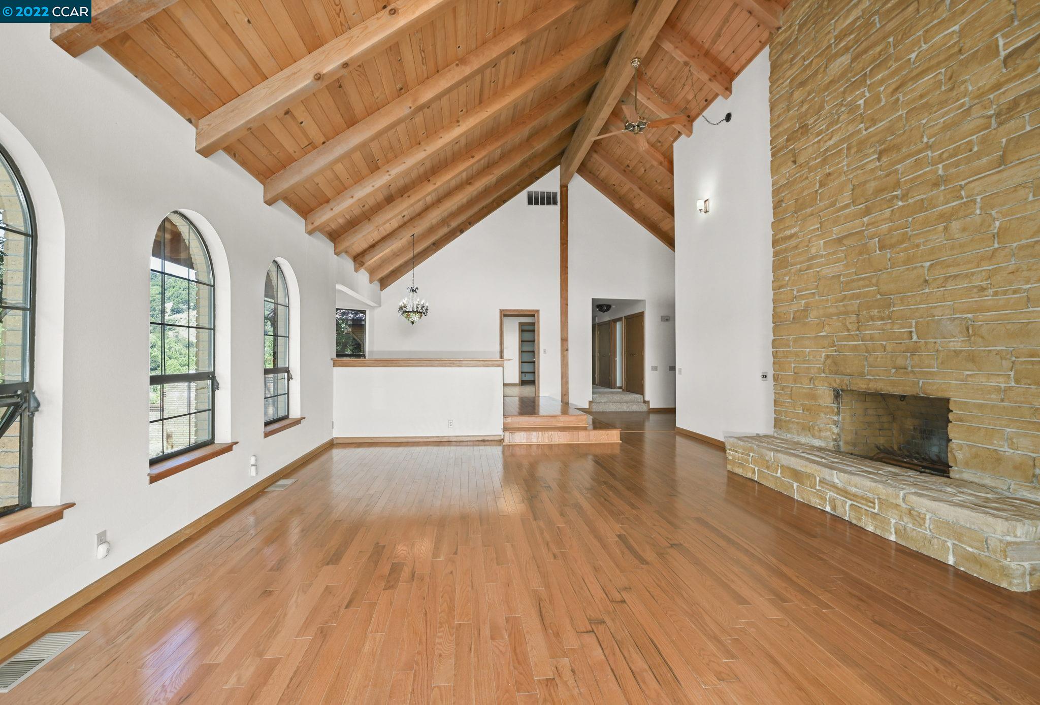 5433 Alhambra Valley Road Martinez, CA 94553 - Photo 9 of 59 a view of empty room with wooden floor and fireplace