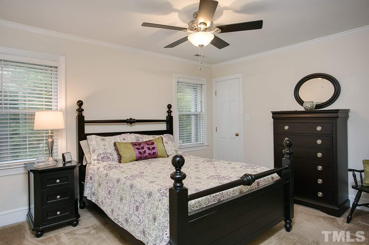 2004 Countrywood Road North Raleigh, NC 27615 - Photo 14 of 25 Spacious bedroom with ceiling fan and walk in closet.
