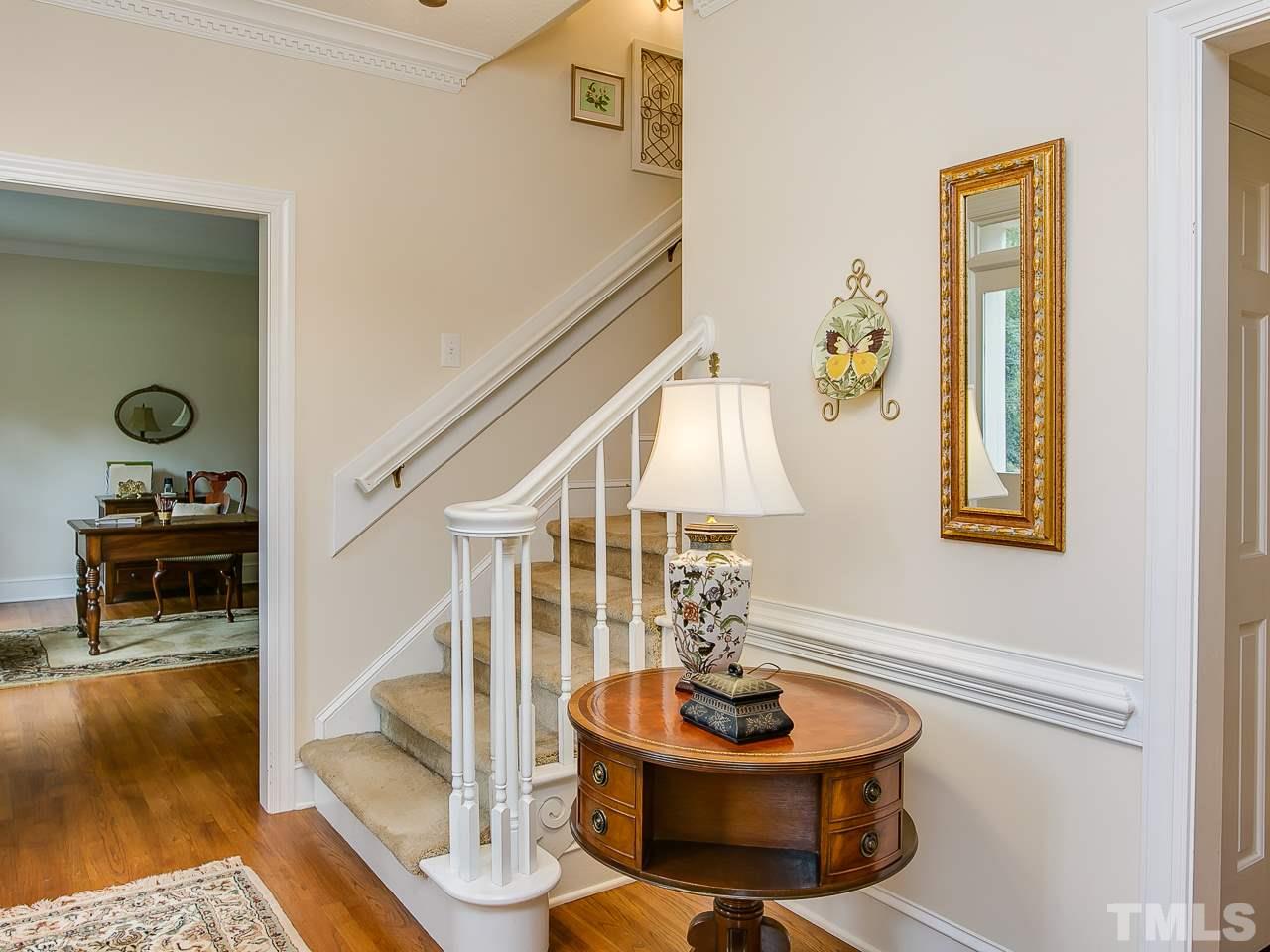 2004 Countrywood Road North Raleigh, NC 27615 - Photo 3 of 25 Entry with solid oak flooring and decorative molding.