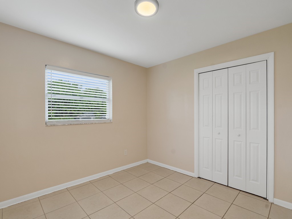 4606 30th Avenue Vero Beach, FL 32967 - Photo 24 of 33 a view of an empty room with window and cabinet