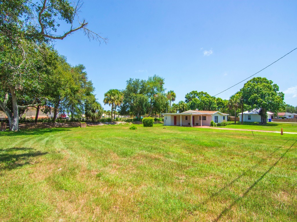 4606 30th Avenue Vero Beach, FL 32967 - Photo 4 of 33 a view of a park with large trees