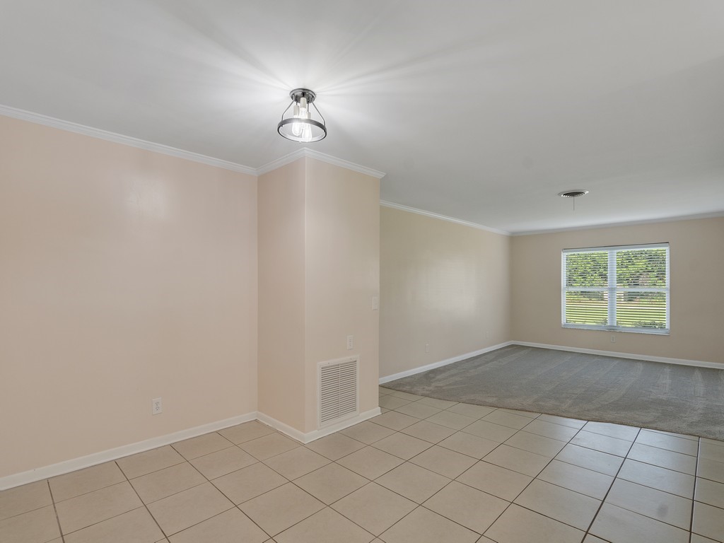4606 30th Avenue Vero Beach, FL 32967 - Photo 9 of 33 an empty room with a empty space and window