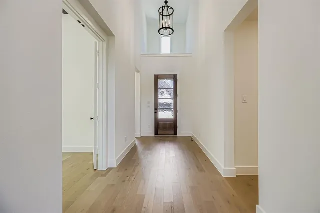 a view of an entryway with wooden floor