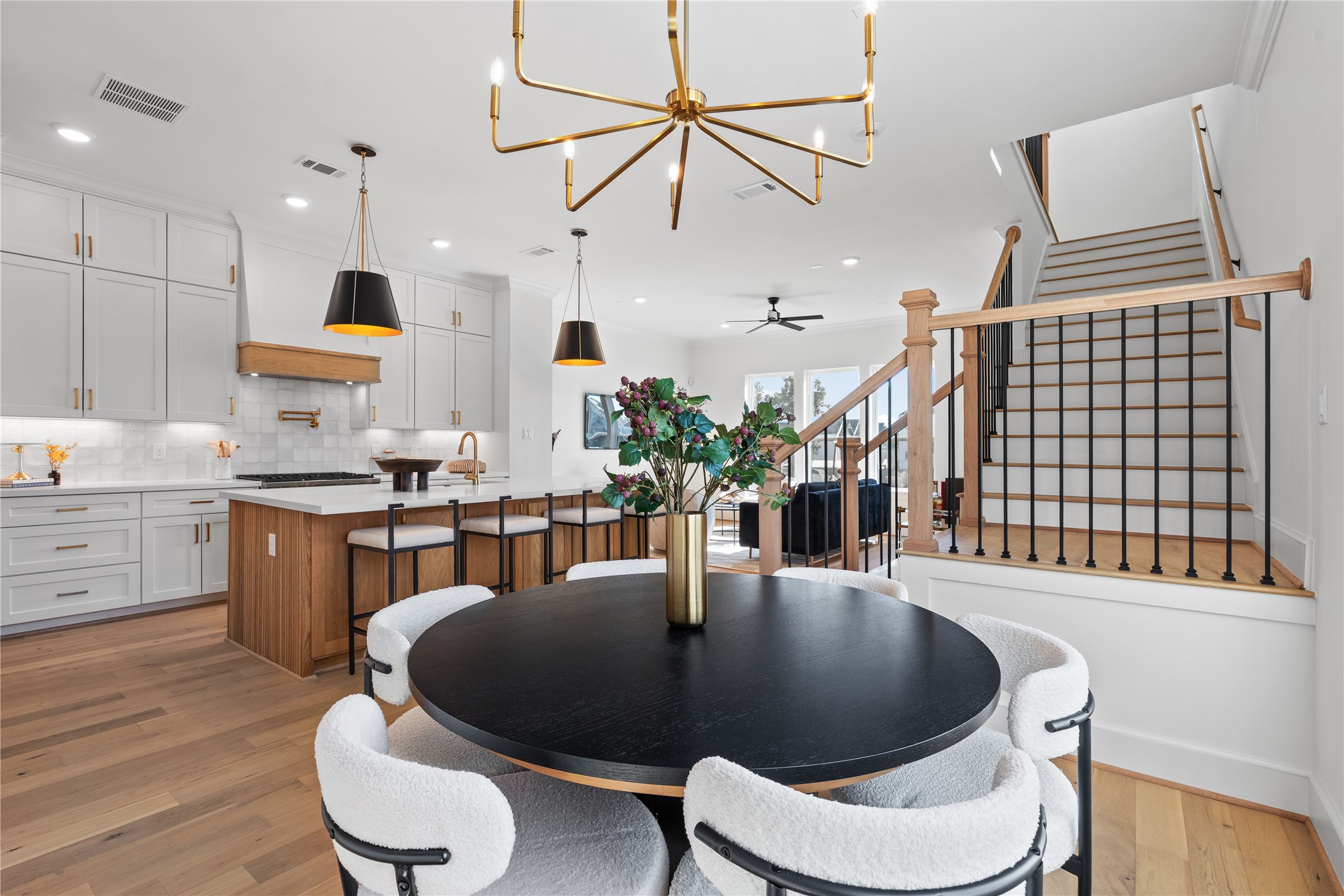 1614 Ojeman Road, Unit C Houston, TX 77055 - Photo 24 of 48 The adjacent dining area offers cozy seating, while the stylish staircase adds a touch of sophistication.