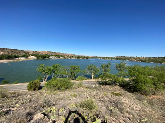 a view of a lake with mountains in the background