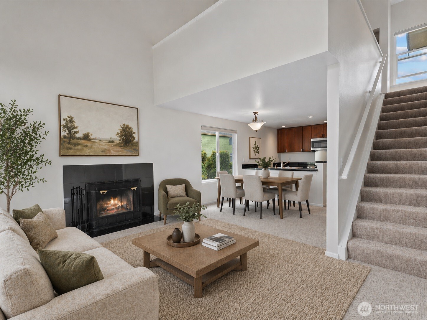 1109 North Allen Place, Unit 205 Seattle, WA 98103 - Photo 1 of 26 a living room with furniture and a fireplace