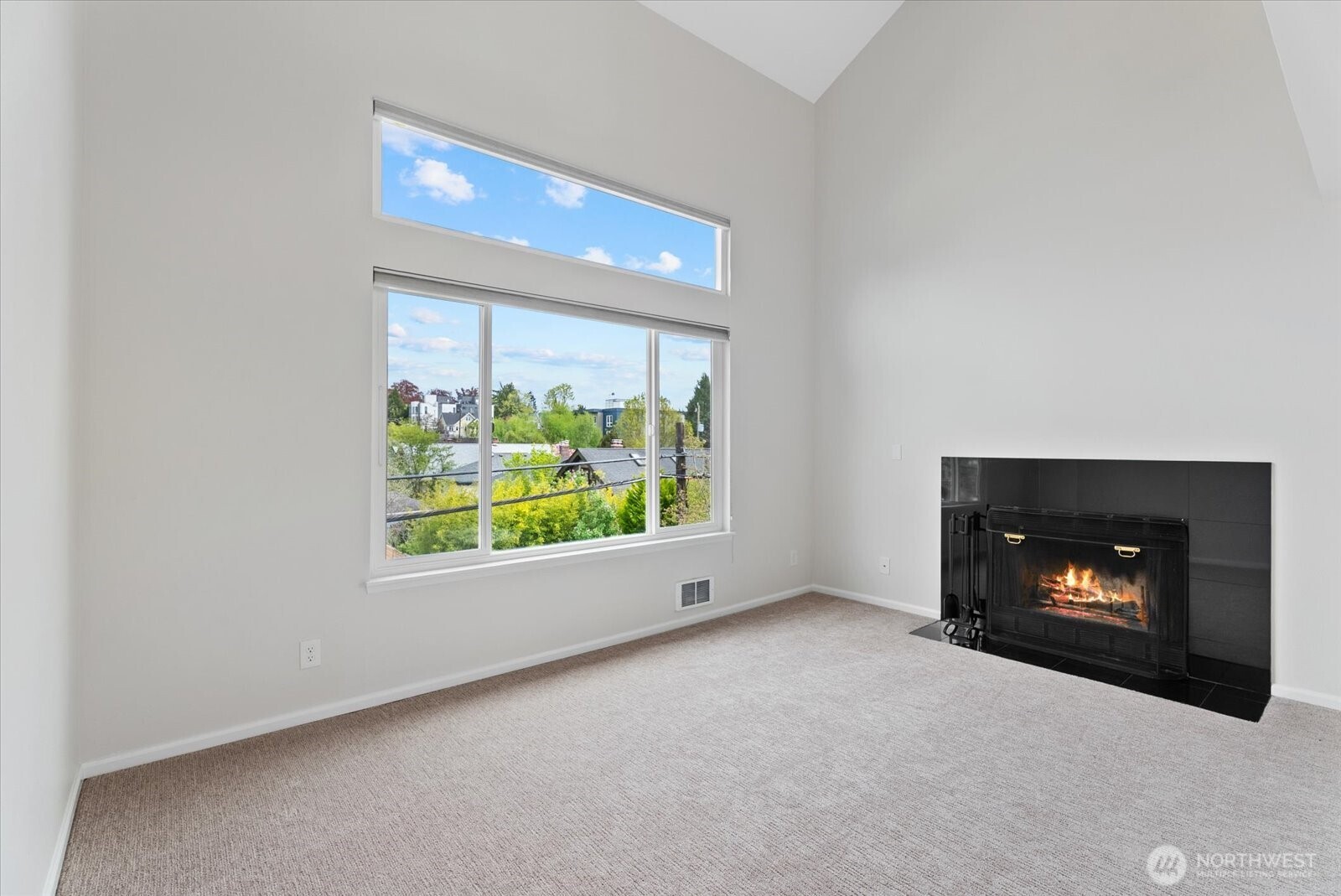1109 North Allen Place, Unit 205 Seattle, WA 98103 - Photo 15 of 26 a view of an empty room with a fireplace