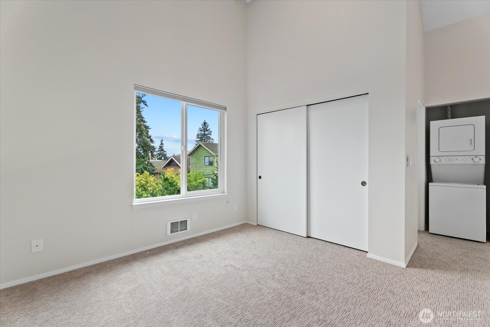 1109 North Allen Place, Unit 205 Seattle, WA 98103 - Photo 17 of 26 an empty room with windows and closet
