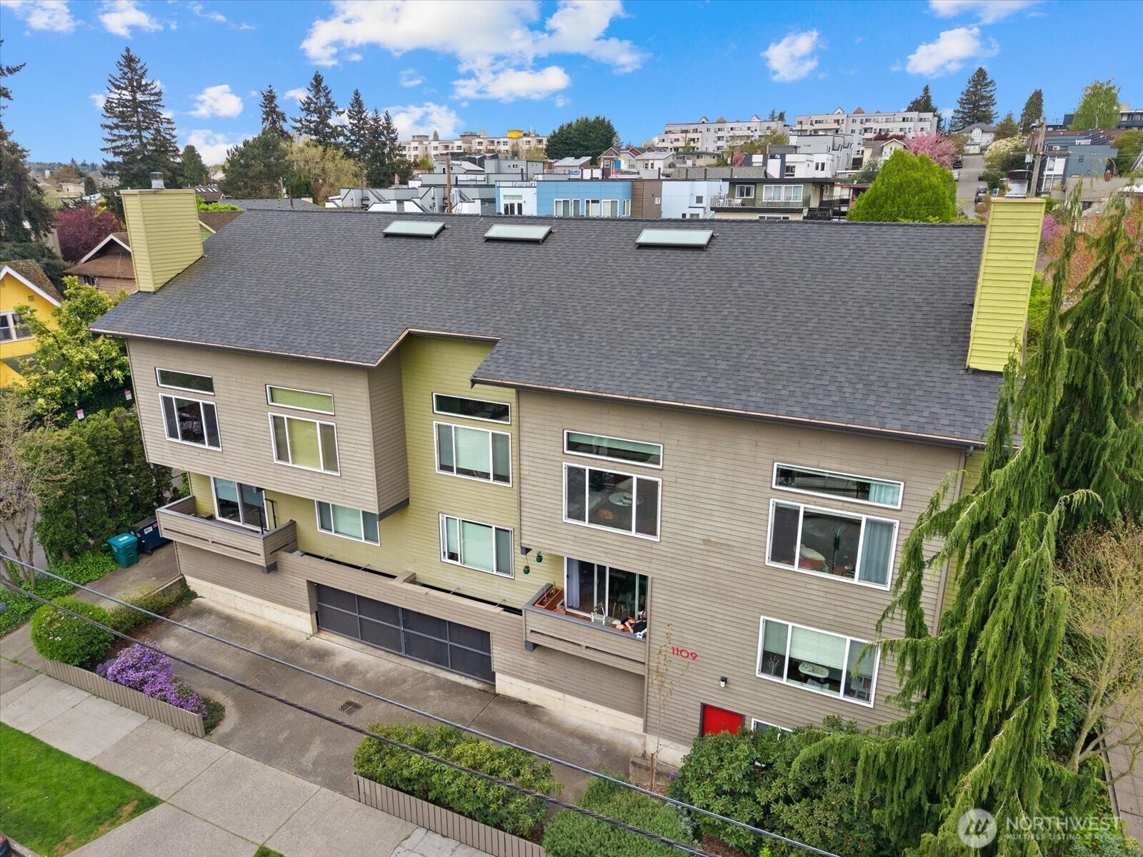 1109 North Allen Place, Unit 205 Seattle, WA 98103 - Photo 18 of 26 a aerial view of a multi story residential apartment building