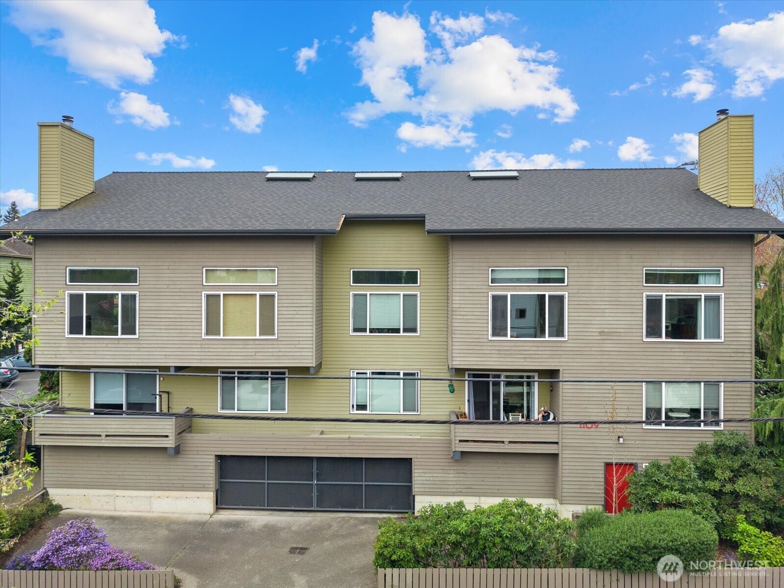 1109 North Allen Place, Unit 205 Seattle, WA 98103 - Photo 19 of 26 a view of a house with a patio