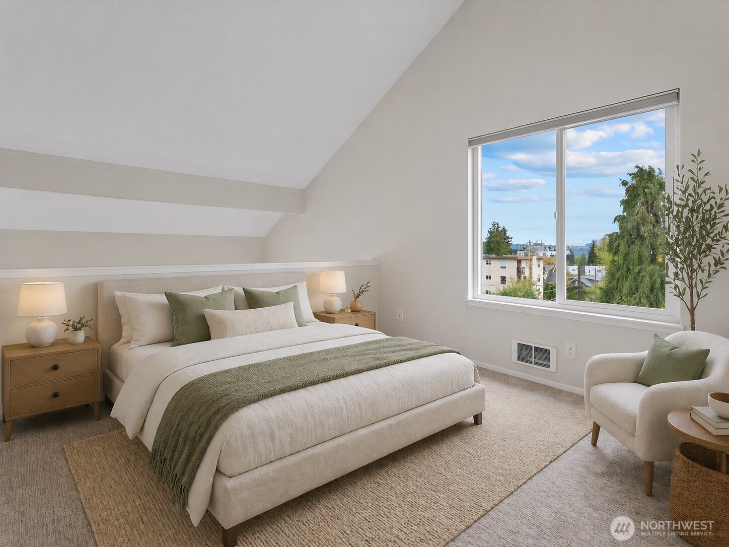 1109 North Allen Place, Unit 205 Seattle, WA 98103 - Photo 2 of 26 a bedroom with a bed and a large window
