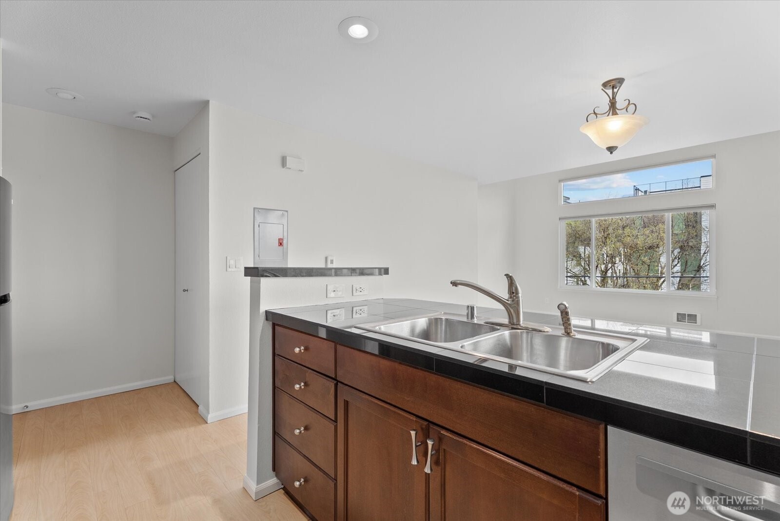 1109 North Allen Place, Unit 205 Seattle, WA 98103 - Photo 7 of 26 a bathroom with a sink and a mirror
