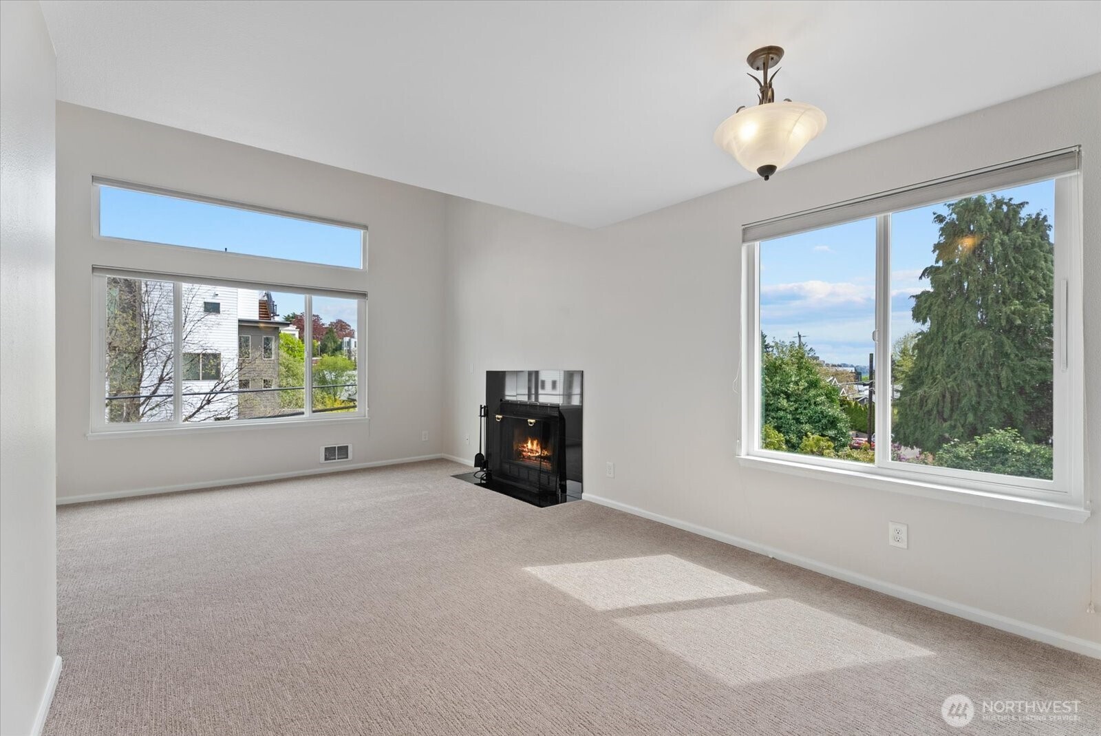 1109 North Allen Place, Unit 205 Seattle, WA 98103 - Photo 8 of 26 a view of an empty room with a window