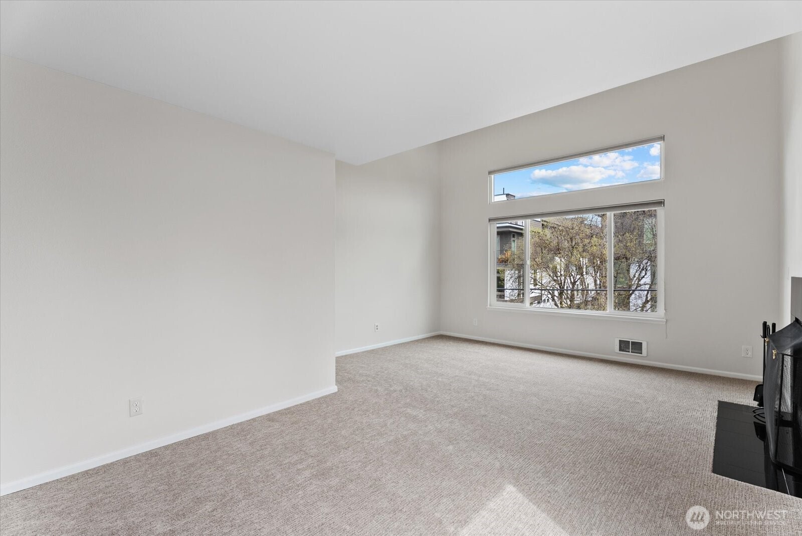 1109 North Allen Place, Unit 205 Seattle, WA 98103 - Photo 9 of 26 a view of an empty room with a window