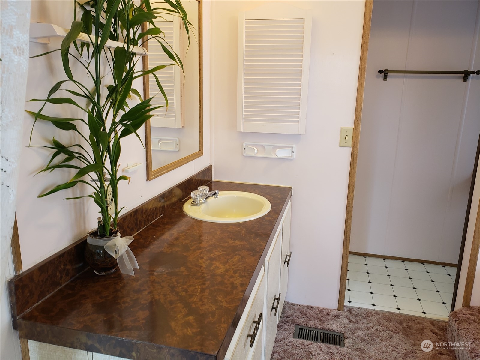 1080 Pine Drive Enumclaw, WA 98022 - Photo 22 of 36 a bathroom with a granite countertop sink a mirror and shower
