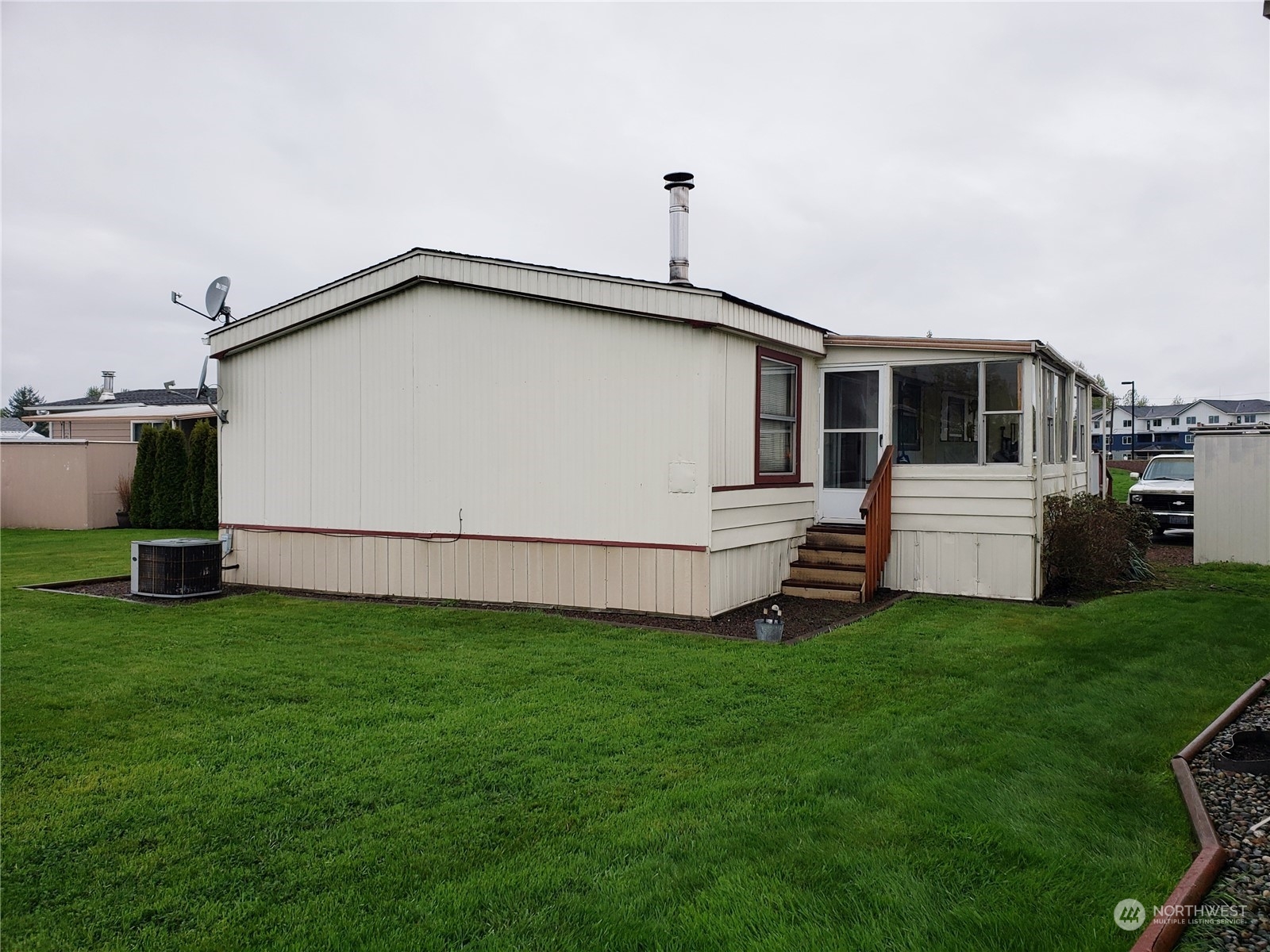 1080 Pine Drive Enumclaw, WA 98022 - Photo 34 of 36 a front view of a house with a garden