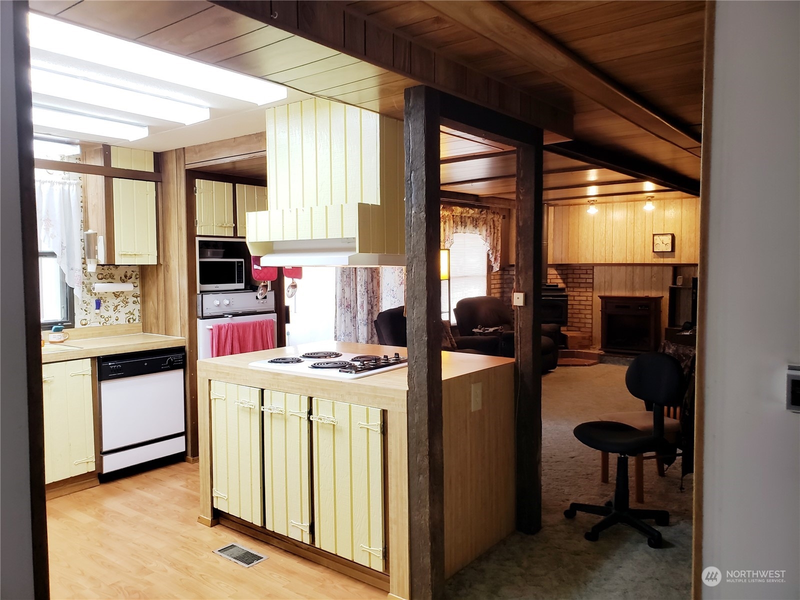 1080 Pine Drive Enumclaw, WA 98022 - Photo 4 of 36 a kitchen with a stove a refrigerator and furniture