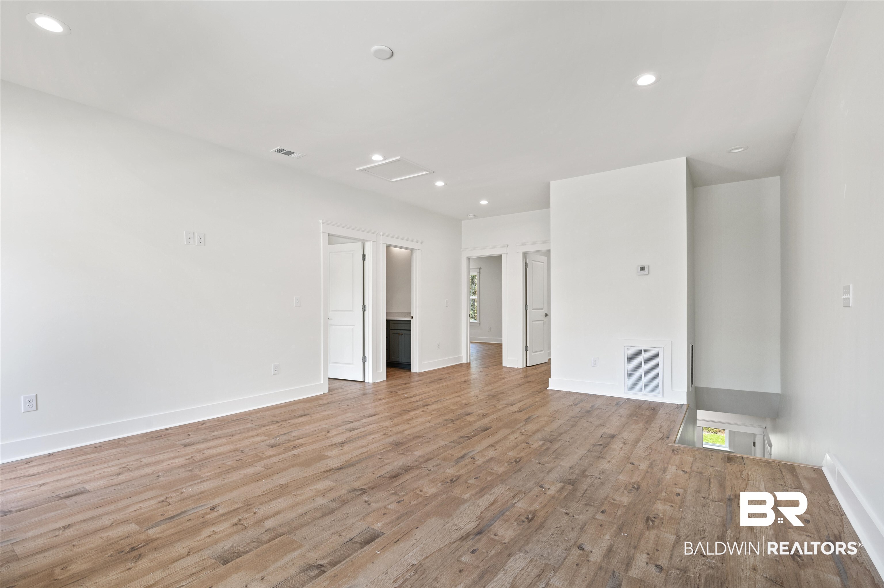 657 Island Way Gulf Shores, AL 36542 - Photo 27 of 59 Spare room with light wood-type flooring, recessed lighting, and baseboards