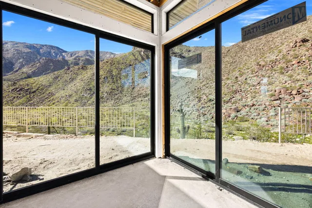 a view of a room with large windows