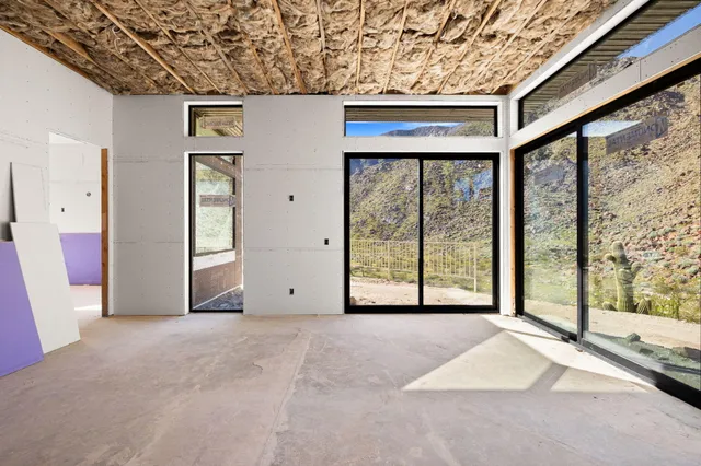 a view of an empty room with windows