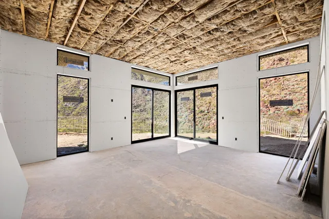 a view of an empty room with windows