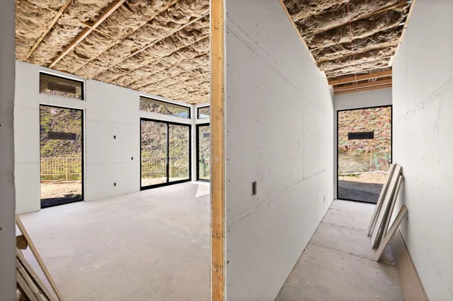 a view of a balcony with chairs