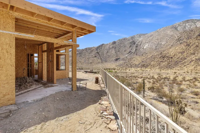 a view of a balcony with a swimming pool