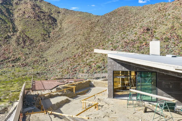 a view of a balcony with chairs
