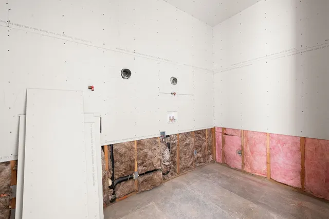 a view of a dry yard with trees