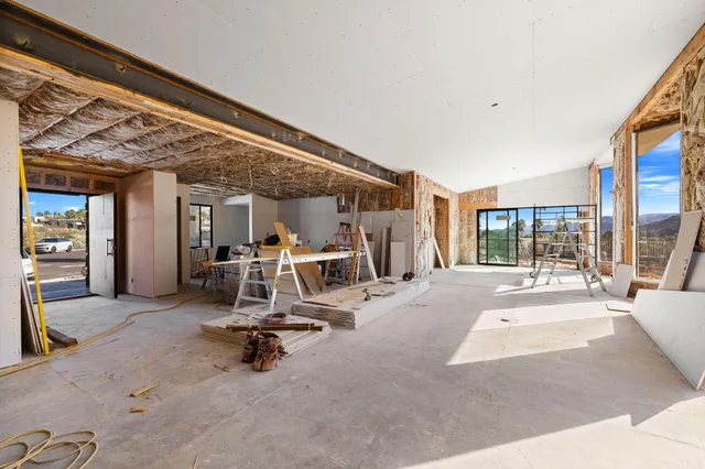 a front view of a house with lots of yellow lighting