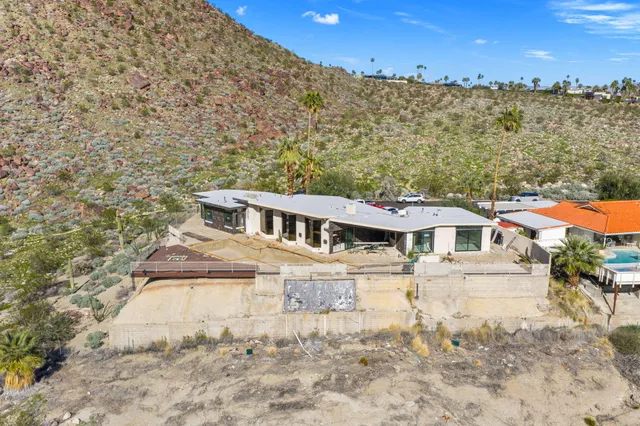 a swimming pool with outdoor seating