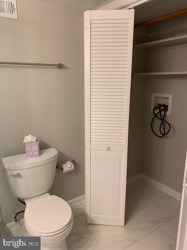 3452 South Utah Street, Unit A Arlington, VA 22206 - Photo 12 of 15 a white toilet sitting next to a shower