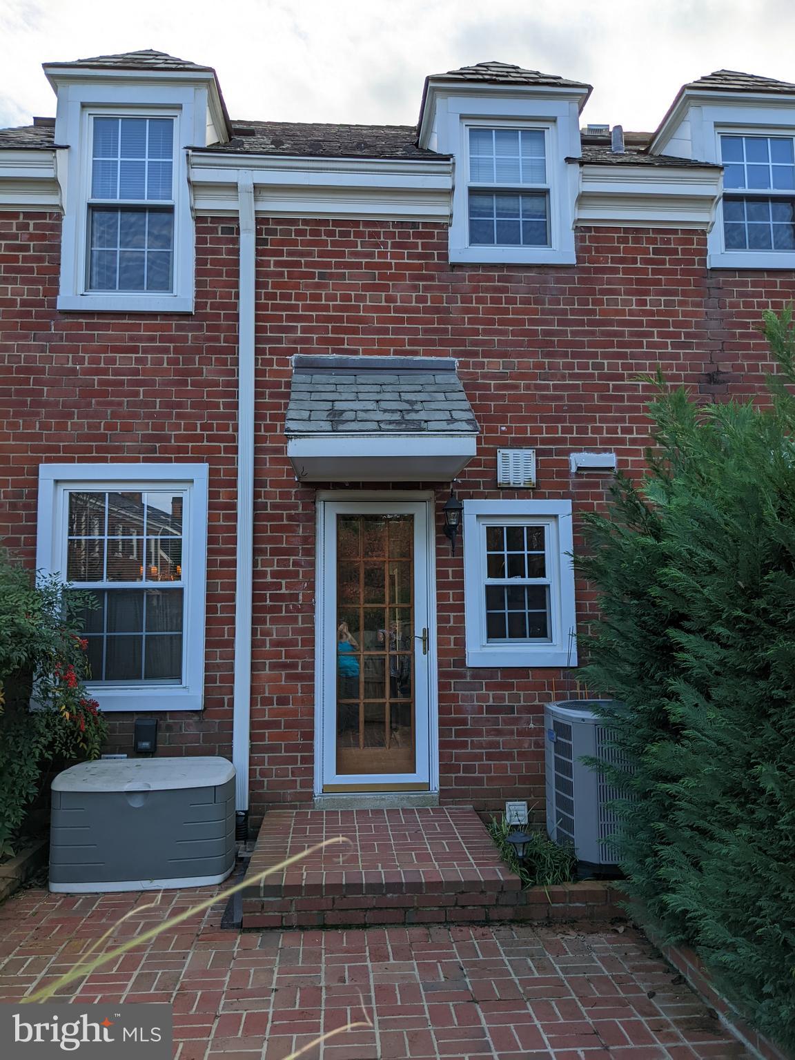 3452 South Utah Street, Unit A Arlington, VA 22206 - Photo 15 of 15 a front view of a house with garden