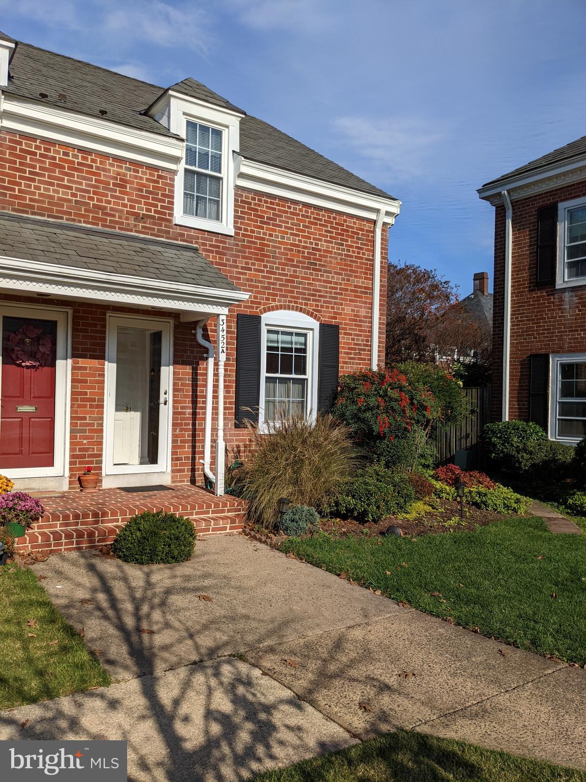 3452 South Utah Street, Unit A Arlington, VA 22206 - Photo 3 of 15 a front view of a house with garden