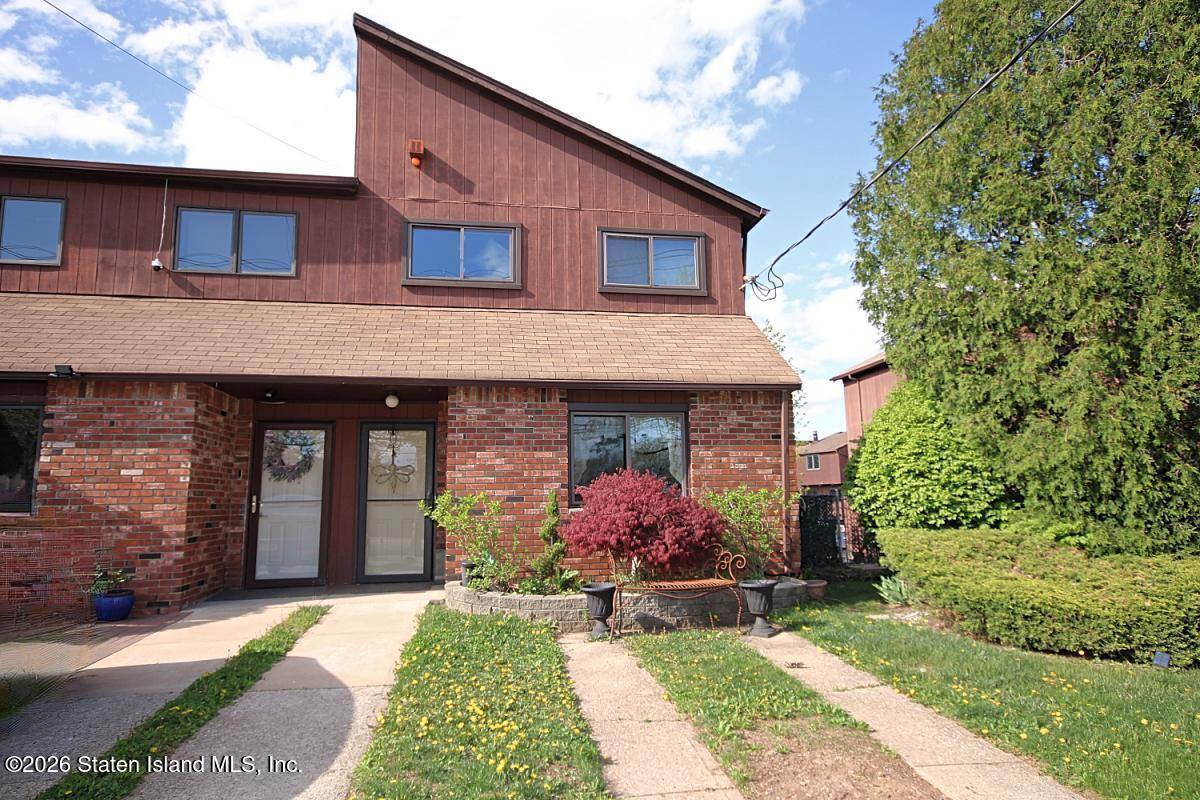 951 West Fingerboard Road Staten Island, NY 10304 - Photo 1 of 29 a front view of a house with garden