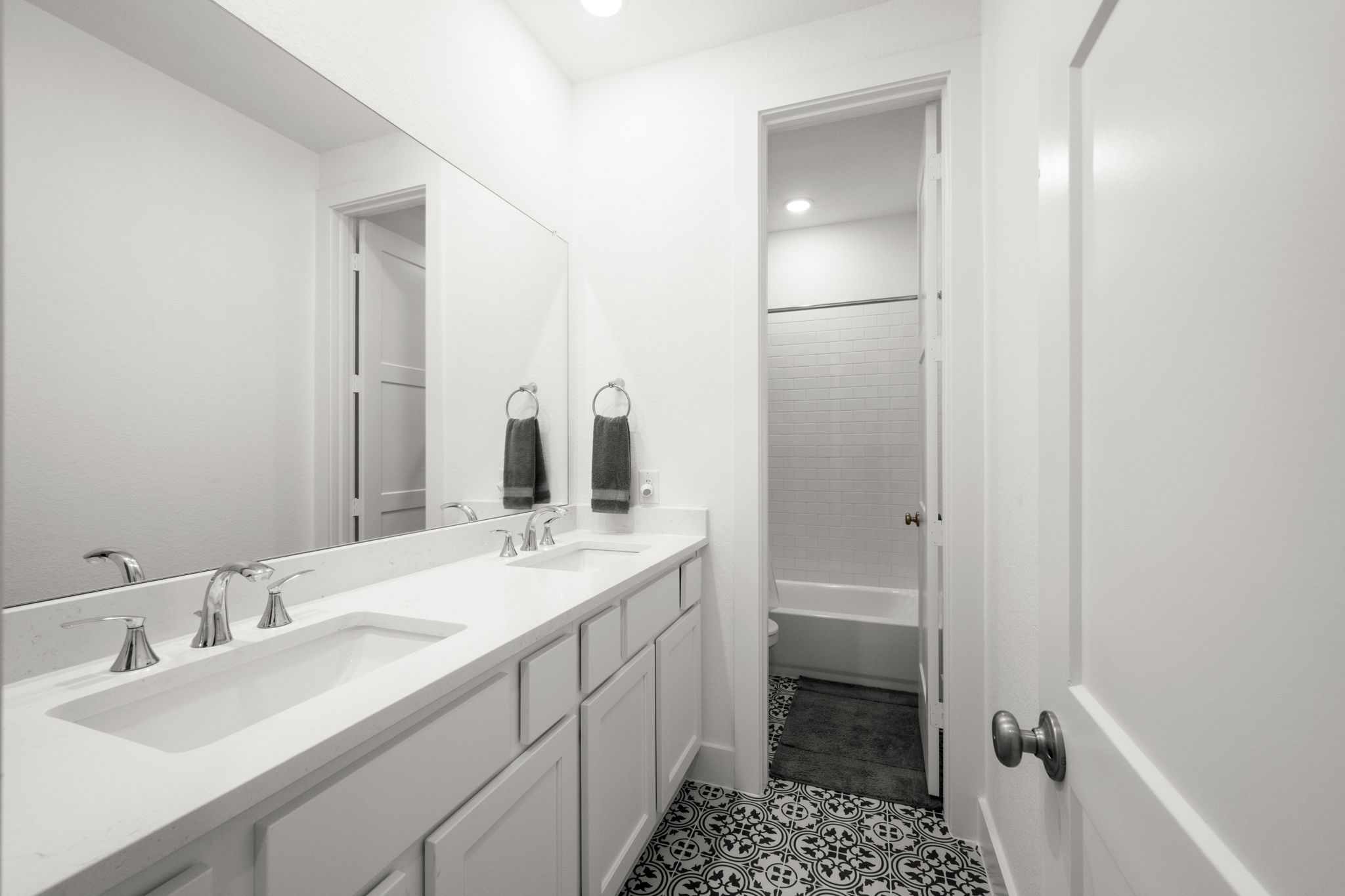13035 Wandering Rdg Lane Conroe, TX 77302 - Photo 23 of 28 a bathroom with a sink and a mirror
