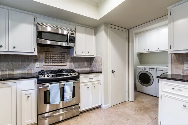 a view of a kitchen with washer and dryer